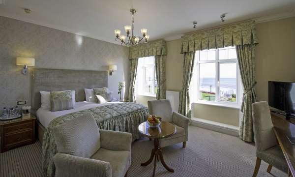Belmont Hotel Deluxe Sea View Room Accommodation Bed and Seating