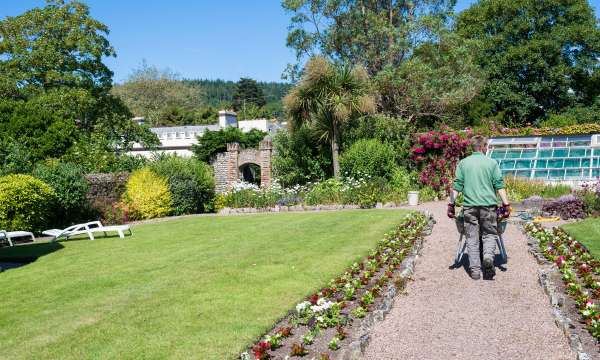 Belmont Hotel Gardener Tending to the Hotel Gardens