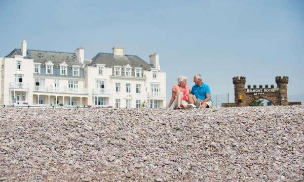 Belmont Hotel Couple Enjoying Pebble Beach in front of Hotel