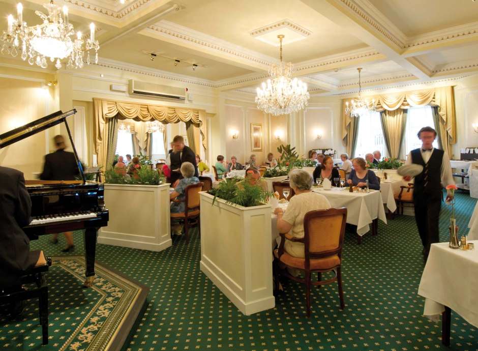 Belmont Hotel Restaurant Dining Area with Pianist and Guests