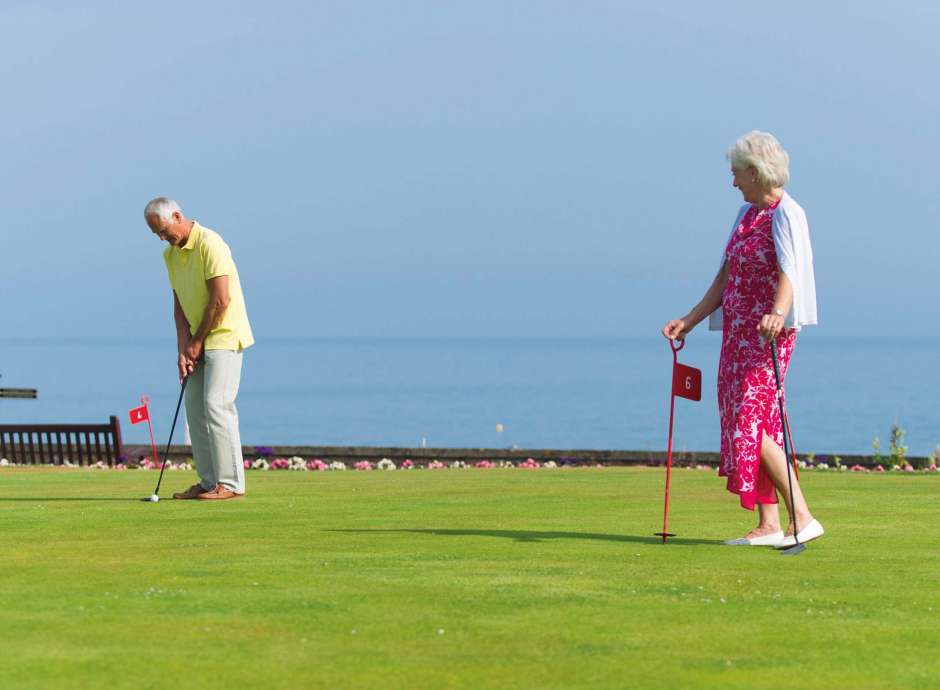 Belmont Hotel Couple Enjoying Putting Green on the Hotel Lawn