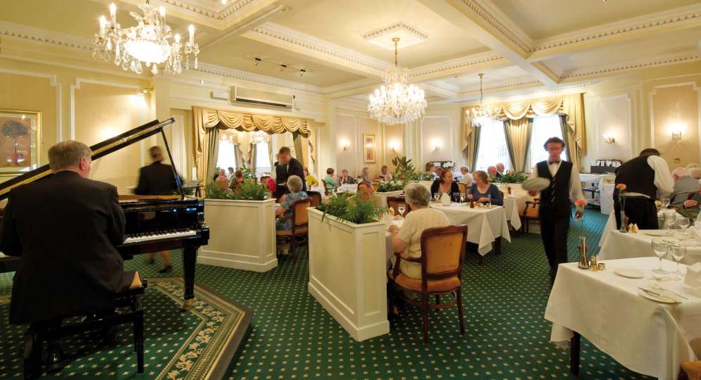 Belmont Hotel Restaurant Dining Area with Pianist and Guests