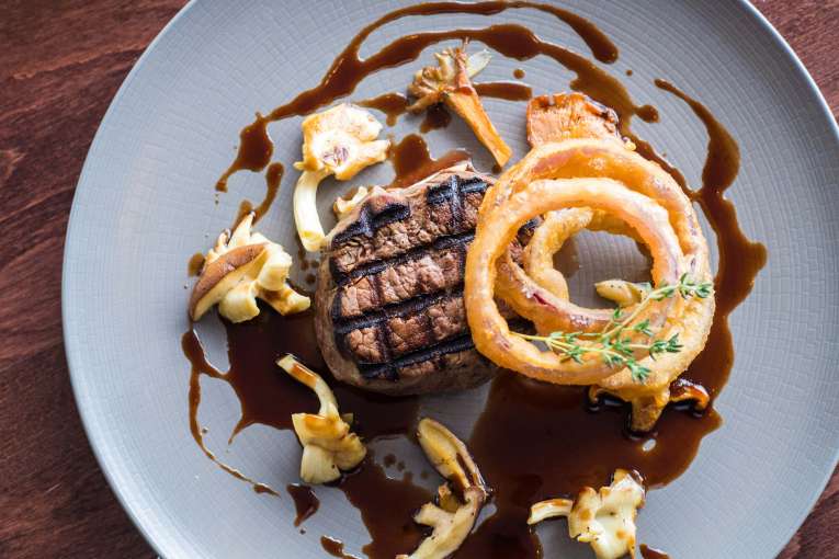 Belmont Hotel Restaurant Dining Fillet Steak with Forest Mushroom and Crispy Onion Rings